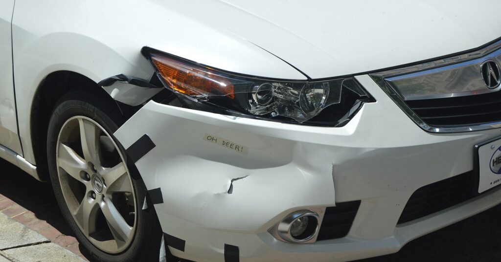 Car with crumpled fender after a minor crash